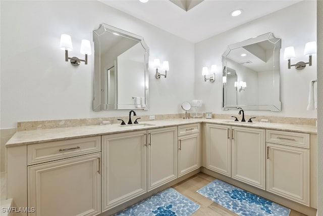 bathroom featuring hardwood / wood-style flooring and vanity