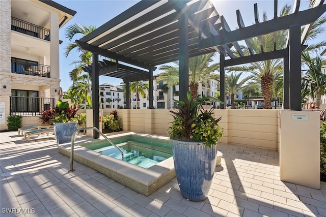 view of pool featuring a pergola, a hot tub, and a patio