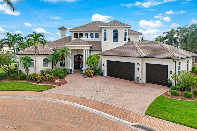 mediterranean / spanish-style house featuring a garage