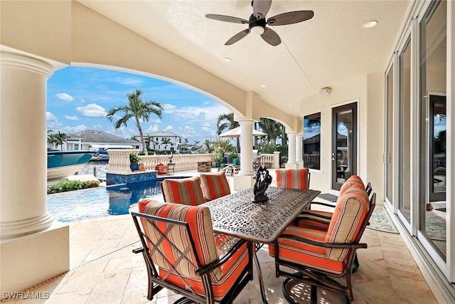 view of patio featuring ceiling fan