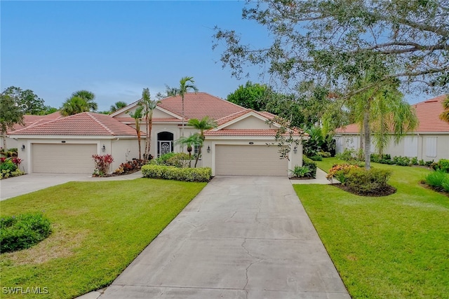 mediterranean / spanish-style house featuring a garage and a front yard