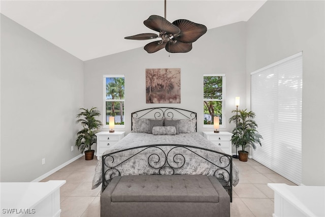 bedroom with light tile patterned floors, high vaulted ceiling, multiple windows, and ceiling fan