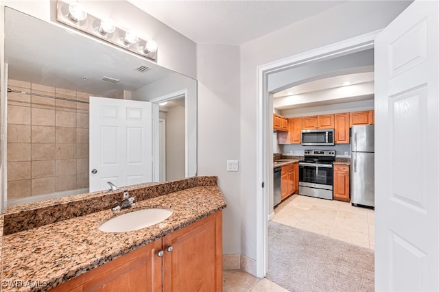 bathroom featuring tile patterned floors and vanity