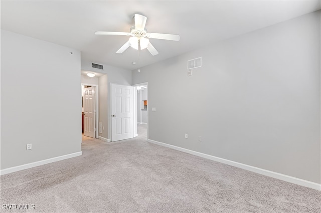 unfurnished bedroom featuring ceiling fan and light carpet