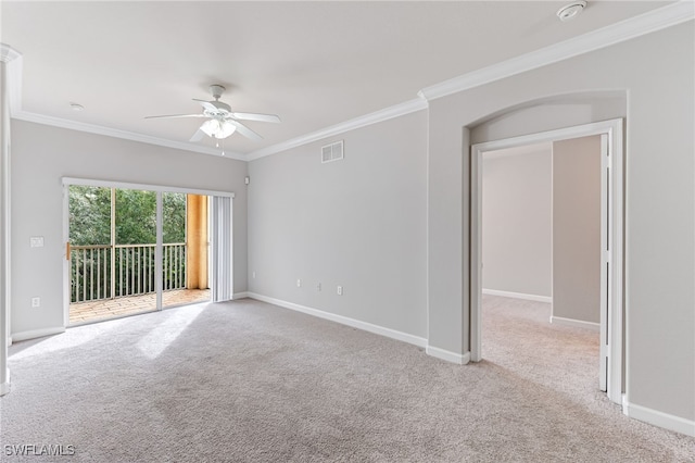 unfurnished room featuring light carpet, ceiling fan, and ornamental molding