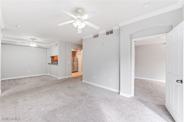 unfurnished living room featuring light carpet, ceiling fan, and crown molding