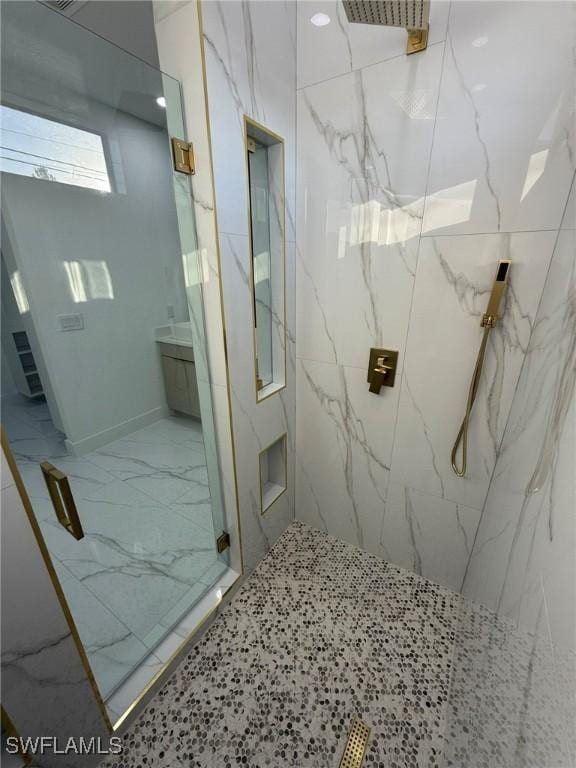 bathroom featuring a shower with door