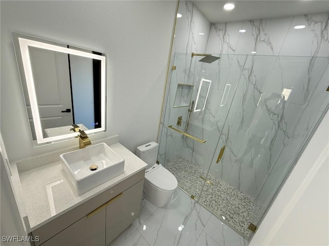 bathroom featuring vanity, walk in shower, and toilet