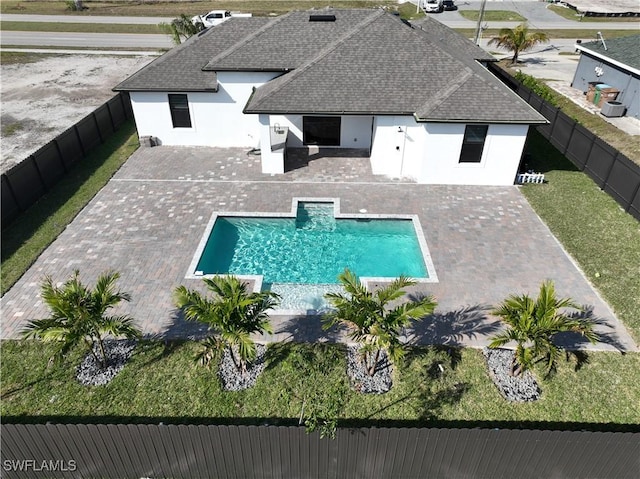 view of pool featuring a patio and a lawn