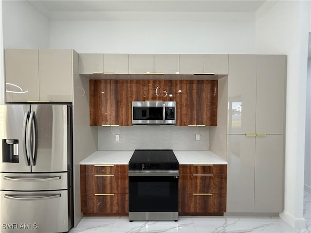 kitchen with tasteful backsplash and stainless steel appliances