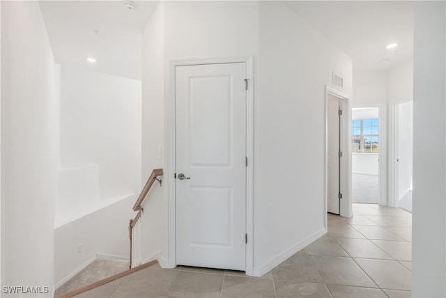 hallway with light tile patterned floors