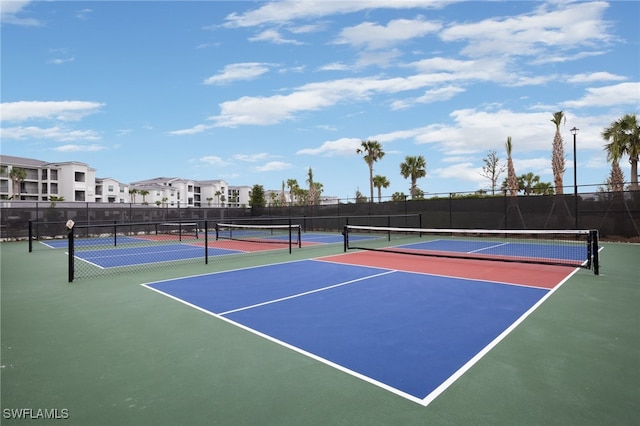 view of tennis court featuring basketball court