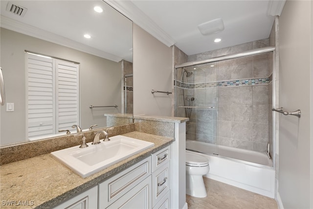 full bathroom with vanity, toilet, ornamental molding, and combined bath / shower with glass door