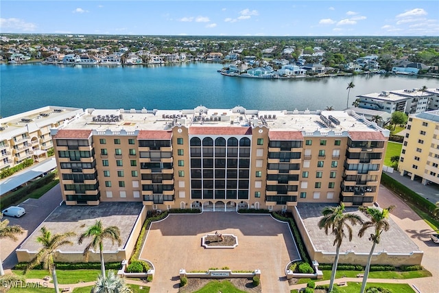 birds eye view of property with a water view