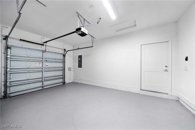 garage featuring electric panel and a garage door opener