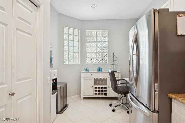 home office with light tile patterned floors