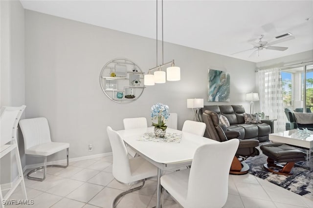 dining space featuring ceiling fan and light tile patterned floors