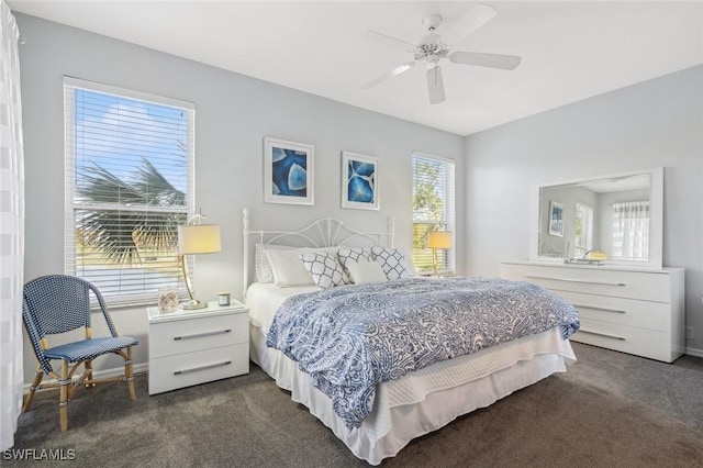 bedroom featuring multiple windows and ceiling fan