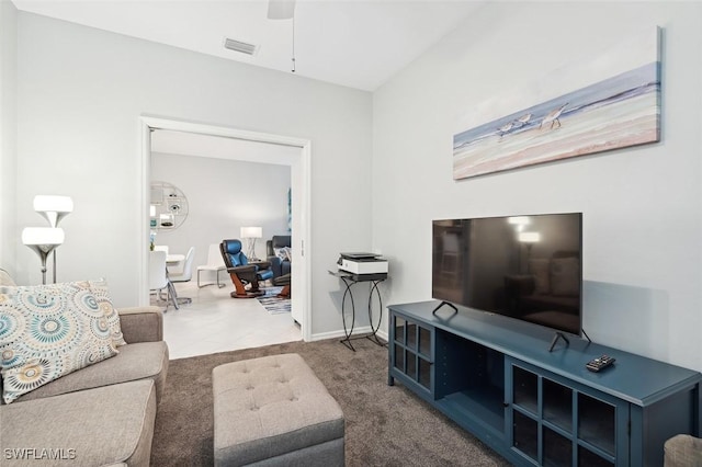 carpeted living room featuring ceiling fan