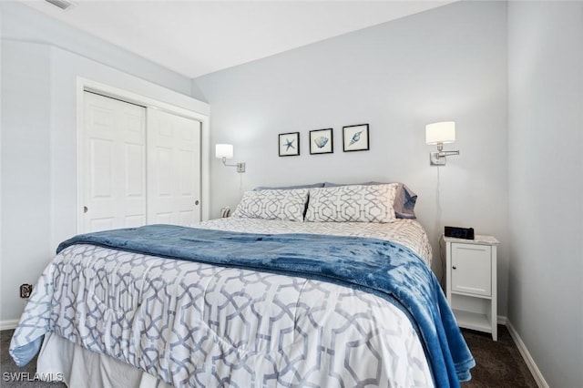 carpeted bedroom with a closet