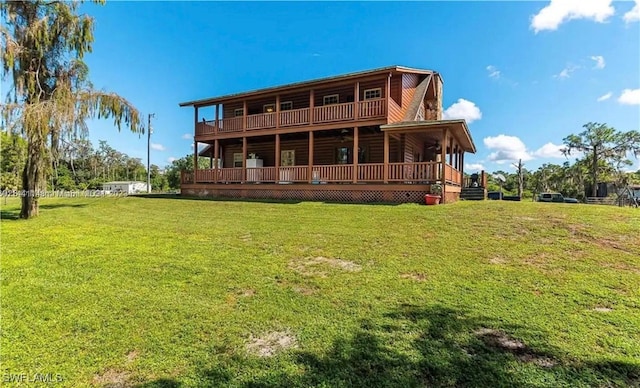 rear view of house with a lawn