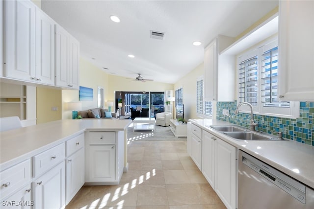 kitchen featuring dishwasher, white cabinetry, and plenty of natural light