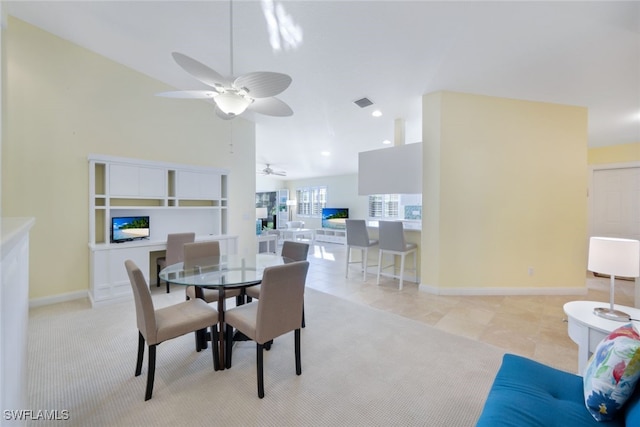 dining space featuring ceiling fan and light tile patterned floors