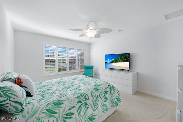 carpeted bedroom featuring ceiling fan