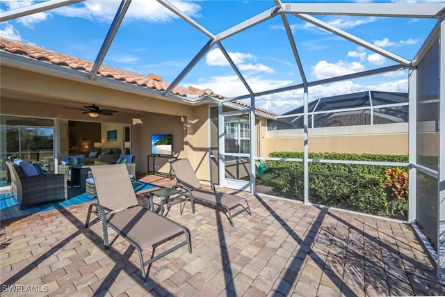 view of patio with a lanai and ceiling fan