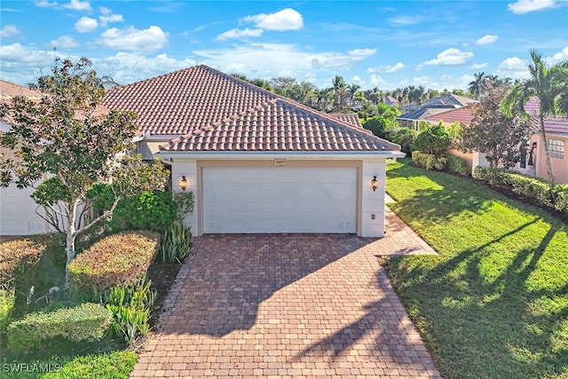 exterior space with a garage and a lawn