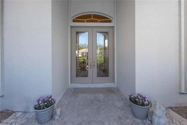 entrance to property featuring french doors