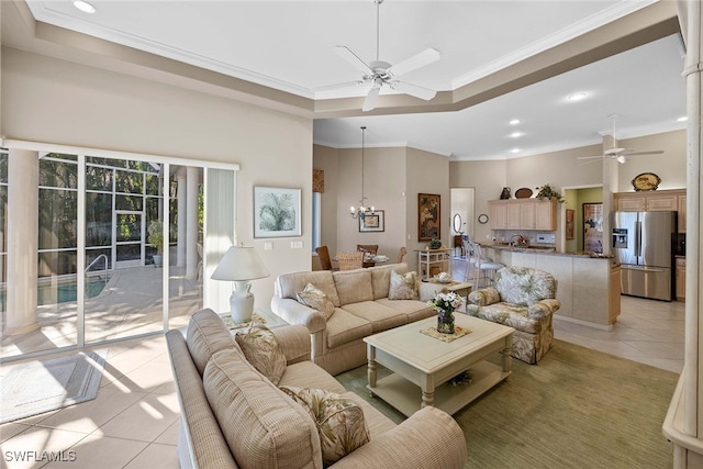 living room featuring crown molding, a towering ceiling, and light tile patterned floors