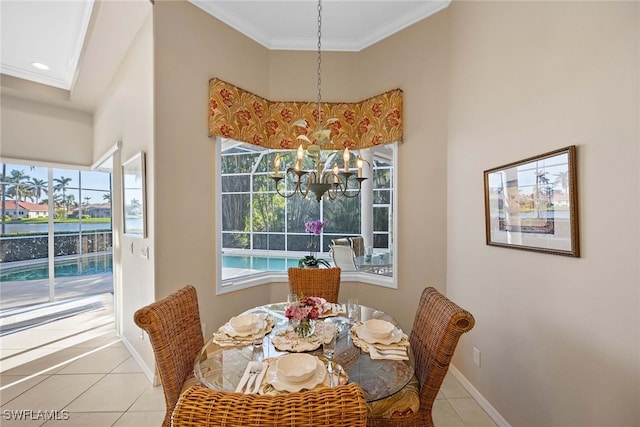 tiled dining space featuring a wealth of natural light, crown molding, and a chandelier