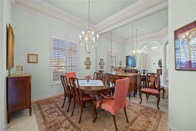 dining space featuring ornamental molding and a chandelier