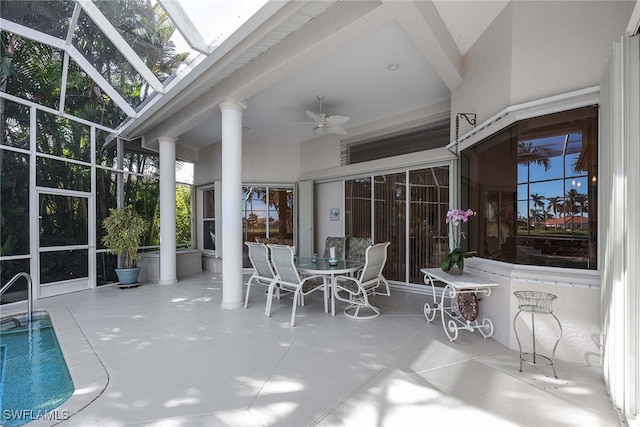 sunroom / solarium featuring ceiling fan