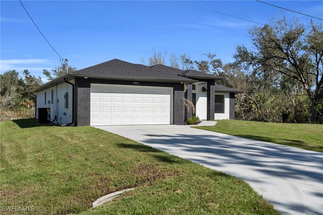 view of front facade with central air condition unit, a front yard, and a garage