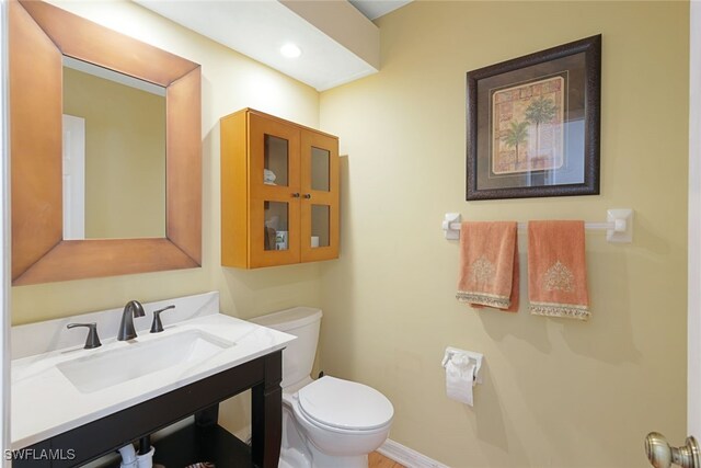 bathroom with vanity and toilet