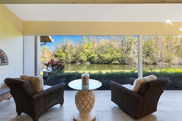 view of patio with a water view