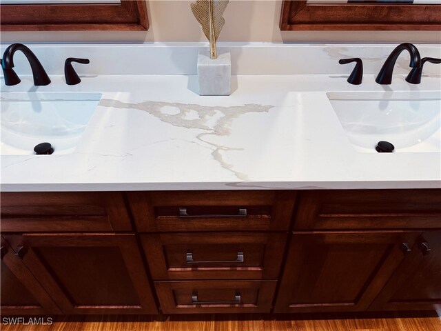 bathroom with sink and hardwood / wood-style flooring