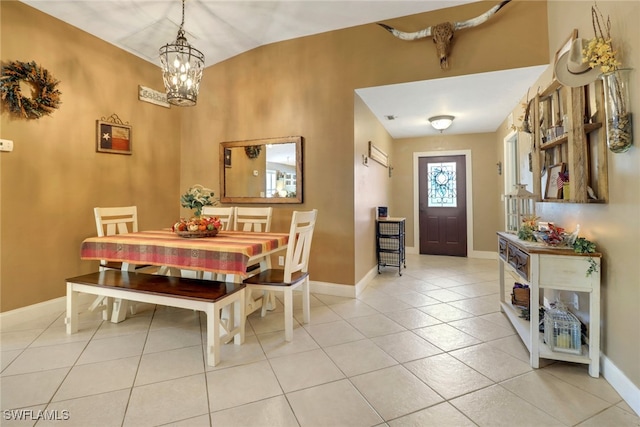 tiled dining area featuring vaulted ceiling and a chandelier