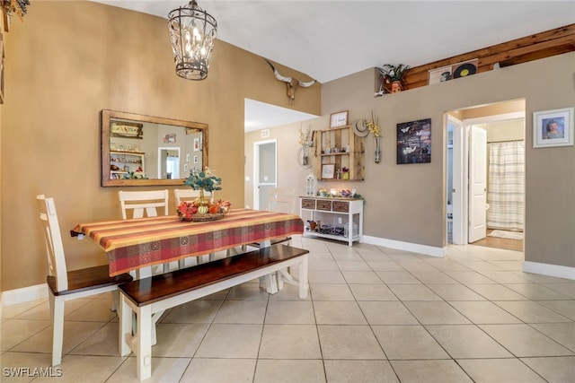 tiled dining space with an inviting chandelier