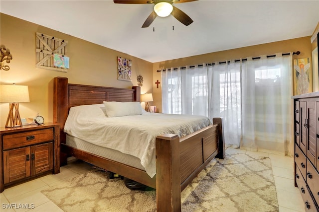 bedroom featuring light tile patterned flooring and ceiling fan