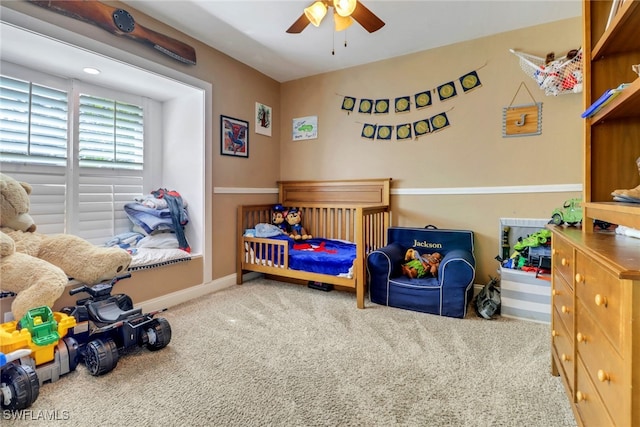 bedroom with ceiling fan and carpet