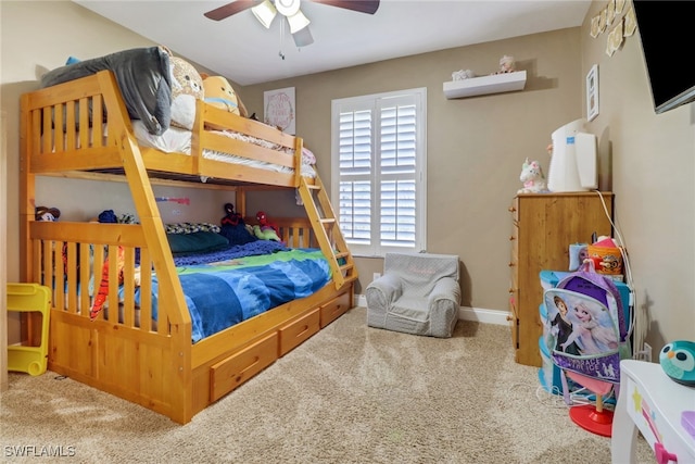 bedroom featuring ceiling fan and carpet