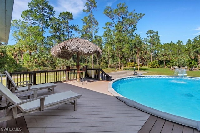 view of swimming pool featuring a wooden deck