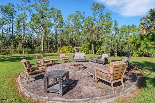 view of patio with a fire pit