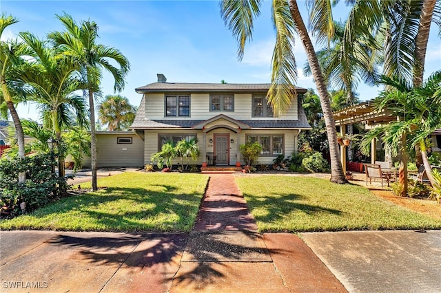 view of front of property featuring a front lawn