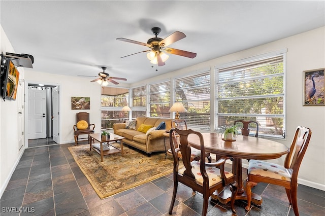 sunroom / solarium with a wealth of natural light and ceiling fan