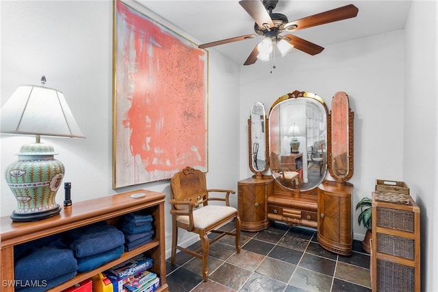 sitting room with ceiling fan