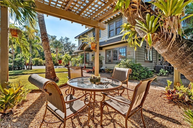 view of patio featuring a pergola and central AC